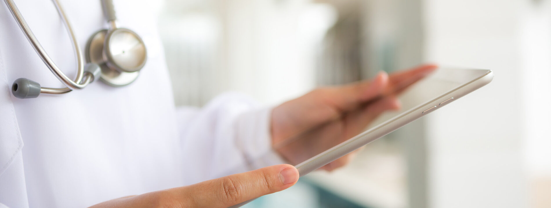 Doctor using tablet computer